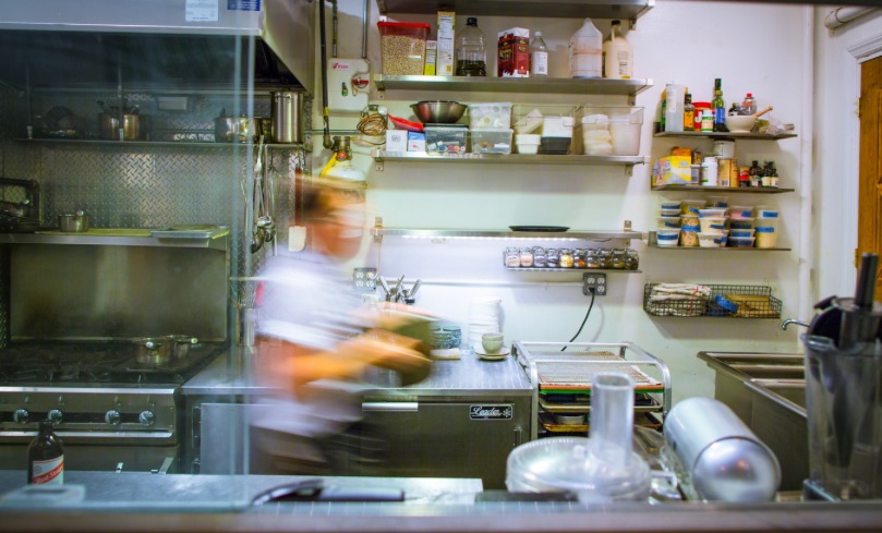 Elise Kornack, on the move in Take Root's kitchen. (photo by Jose Moran Moya; courtesy Take Root)