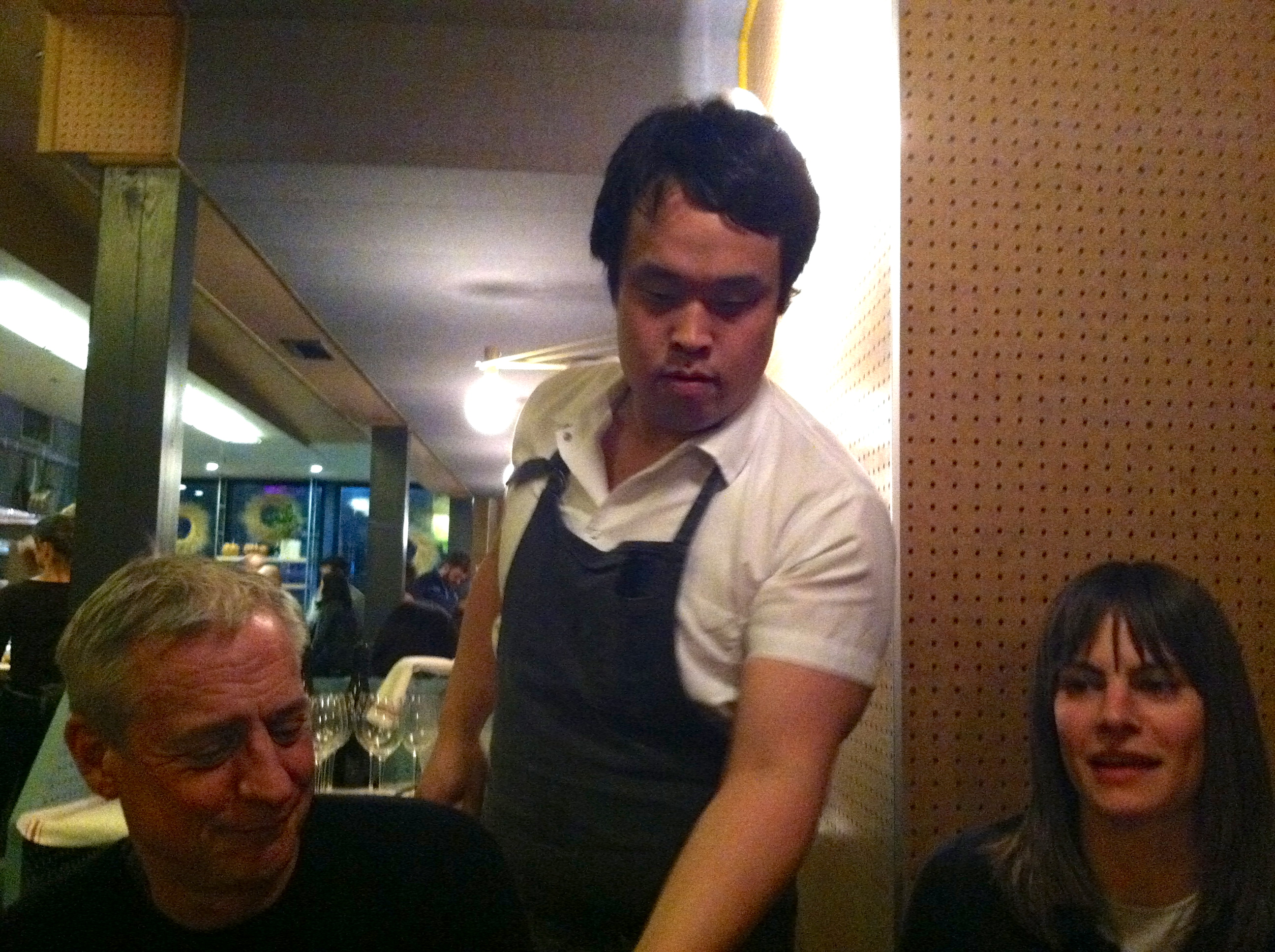 A Member of the Kitchen Team Serves Jimmy Bradley and Roxanne Weber at State Bird Provisions.